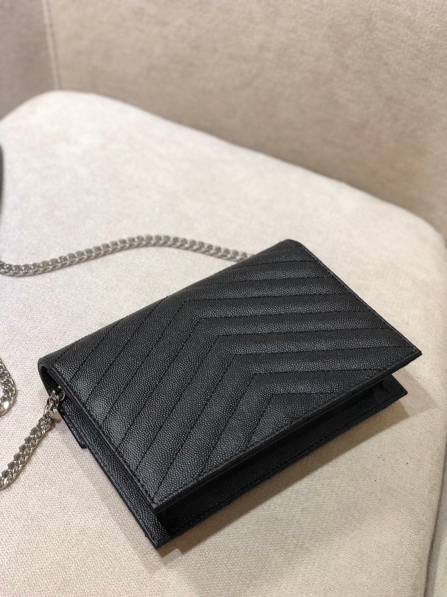 Saint Laurent Cassandre Matelassé Chain Wallet in Black Grain de Poudre Leather