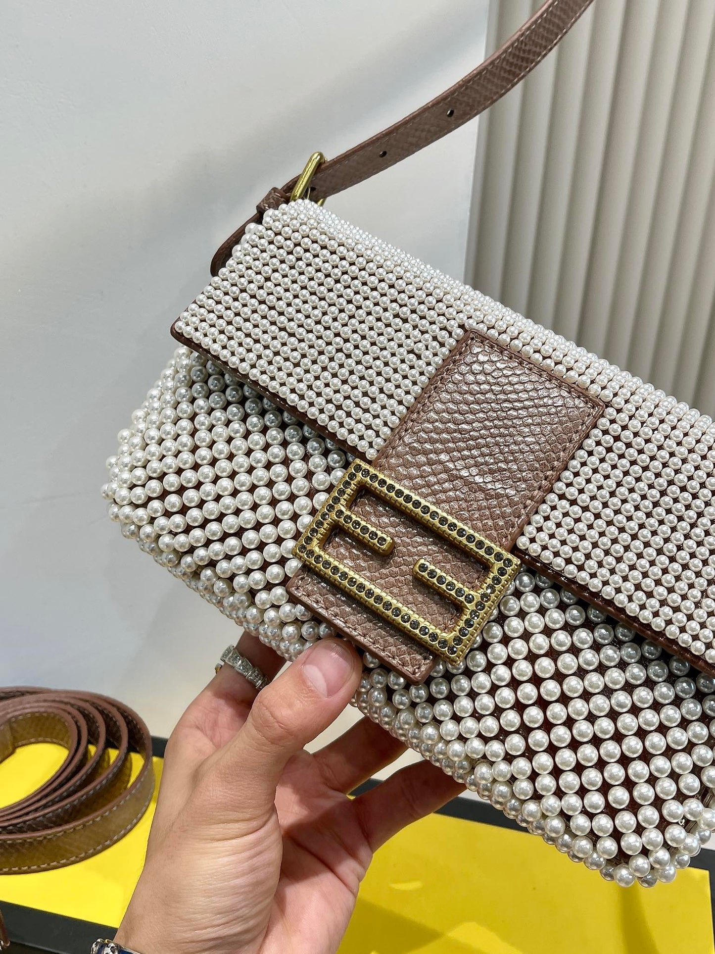 Elegant Textured Weave Baguette Shoulder Bag with Gold-Tone Buckle - Cream and Black