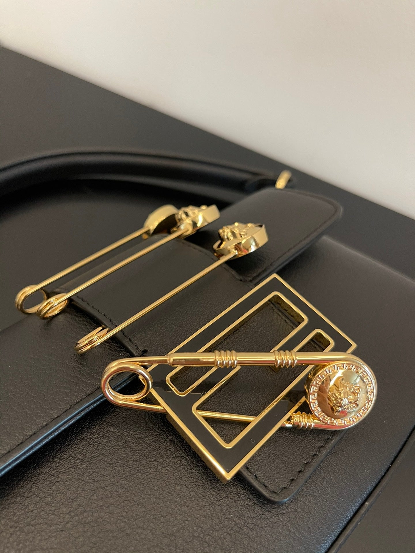 Fendi Black Leather Baguette Bag with Gold Safety Pin Embellishments