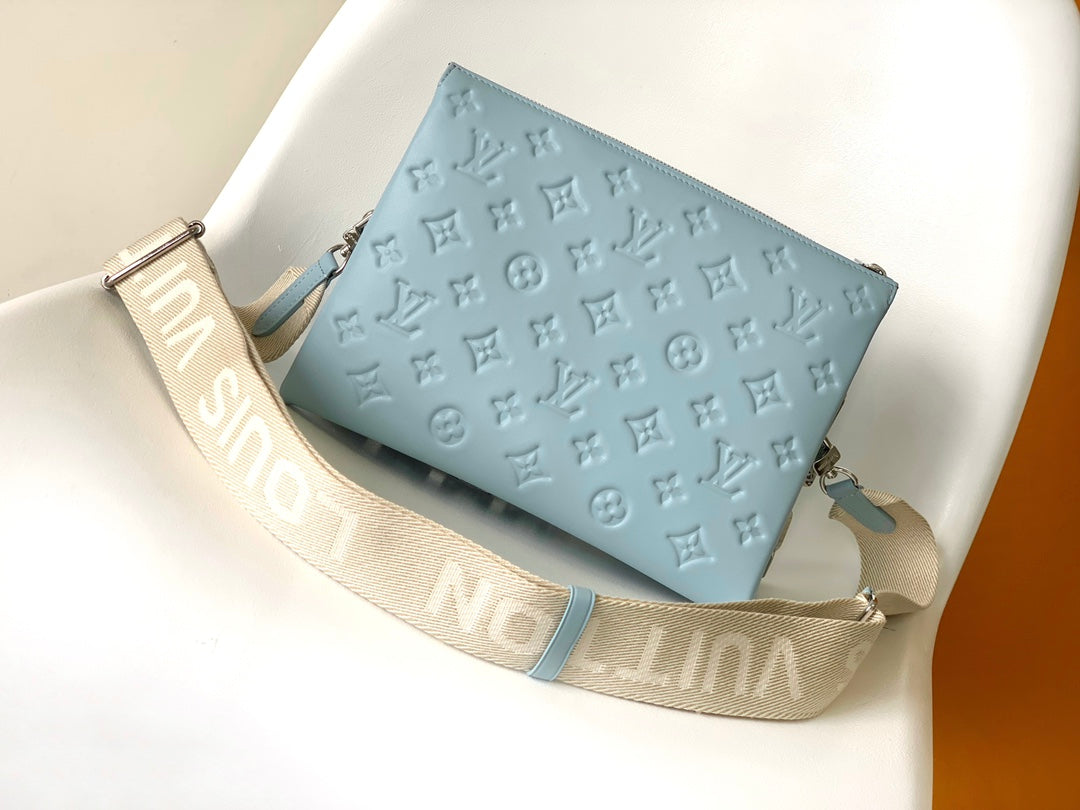 Light Blue Embossed Monogram Leather Crossbody Bag with Silver Chain Strap