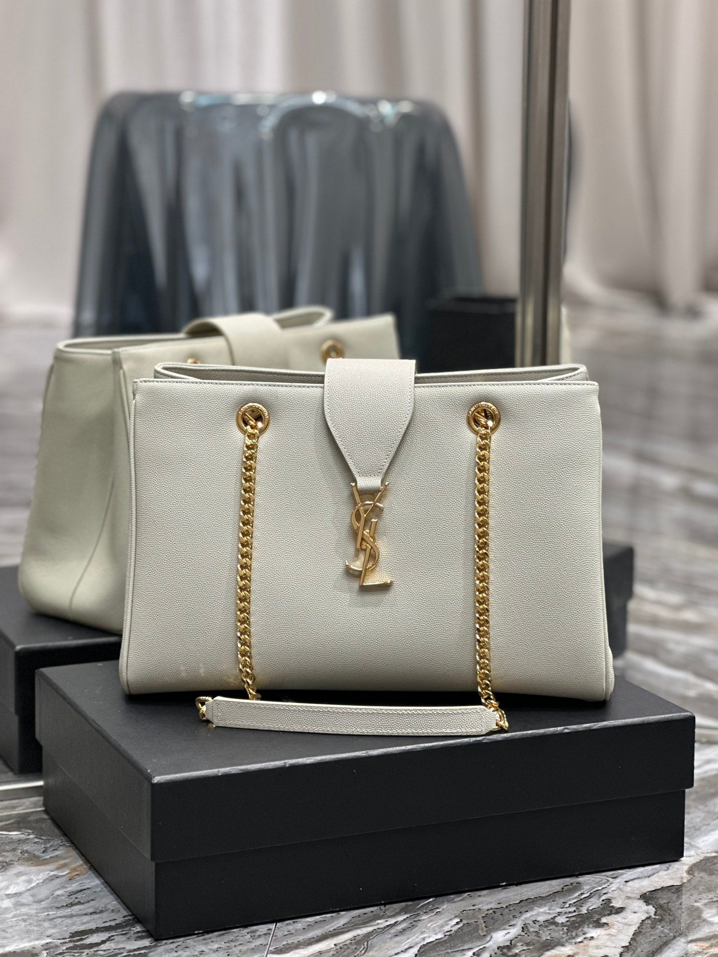 Luxury Off-White Leather Shoulder Bag with Gold Chain and Tassel