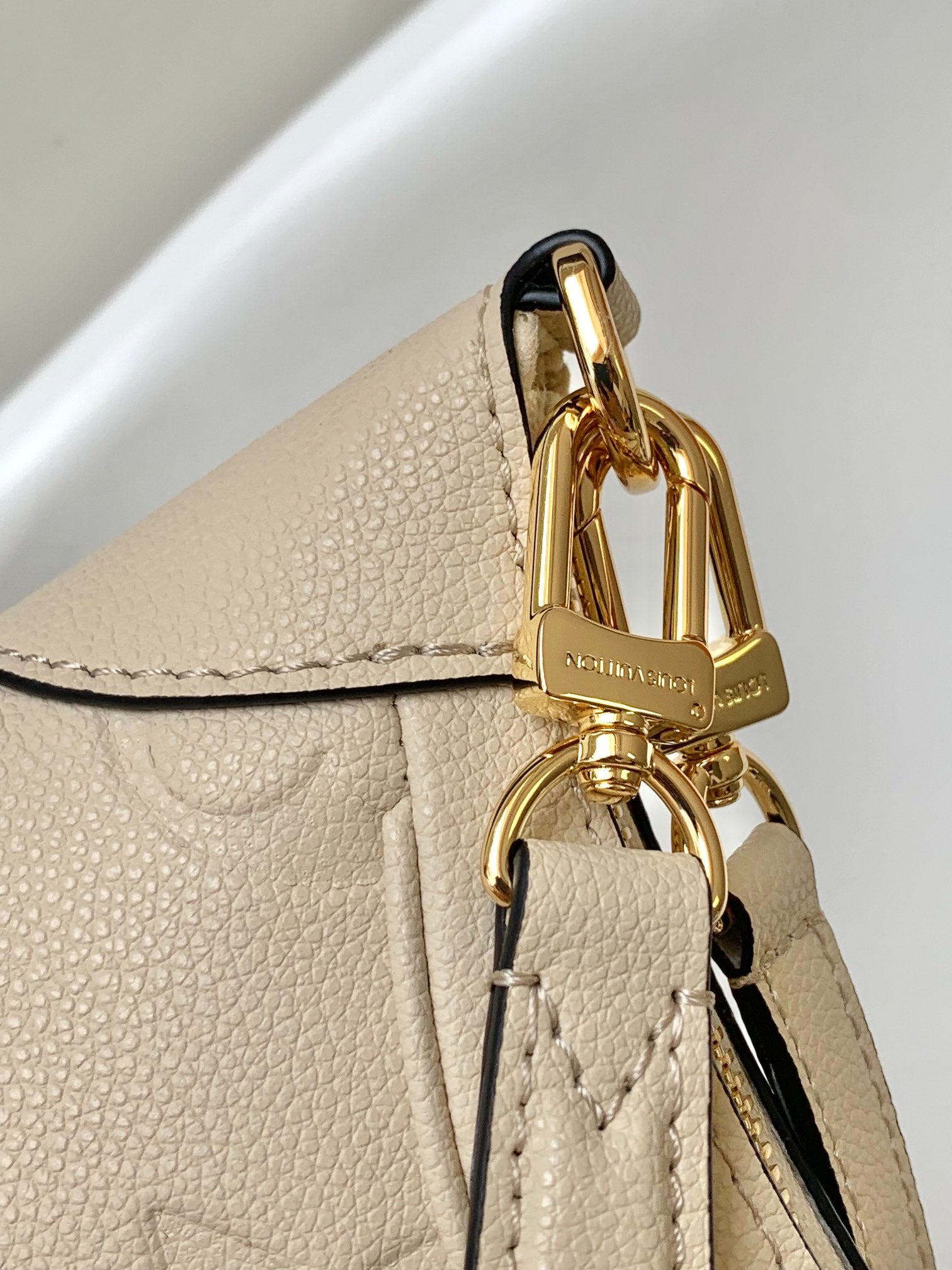 Louis Vuitton Bagatelle Hobo Bag in Monogram Empreinte Leather - Crème Beige