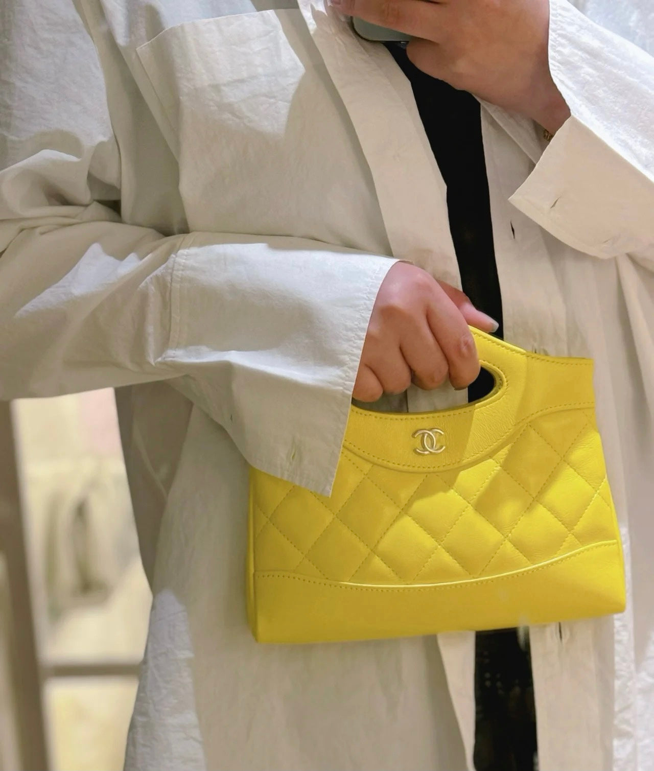 Yellow Quilted Mini Handbag with Gold Chain Strap and Top Handle