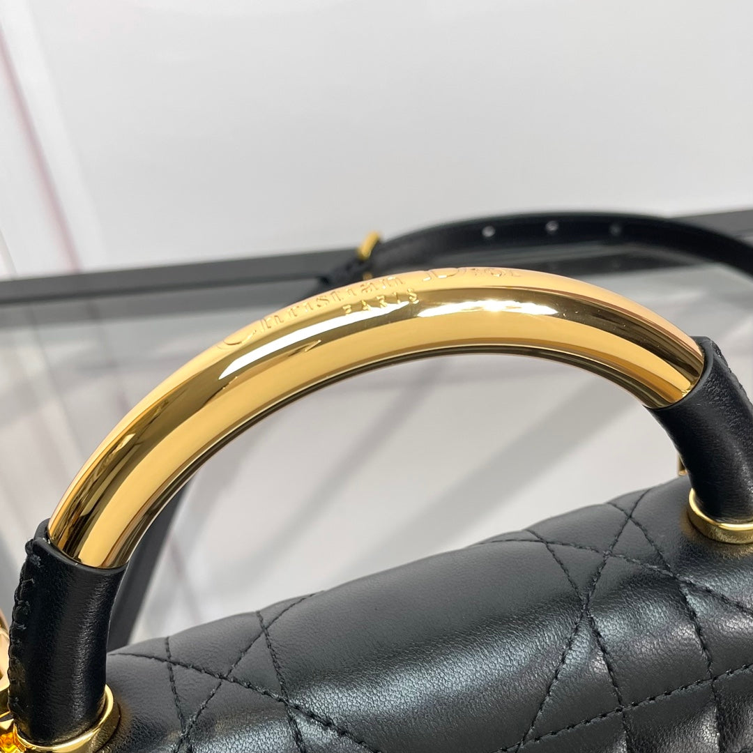 Black Quilted Leather Top Handle Handbag with Gold-Tone Hardware
