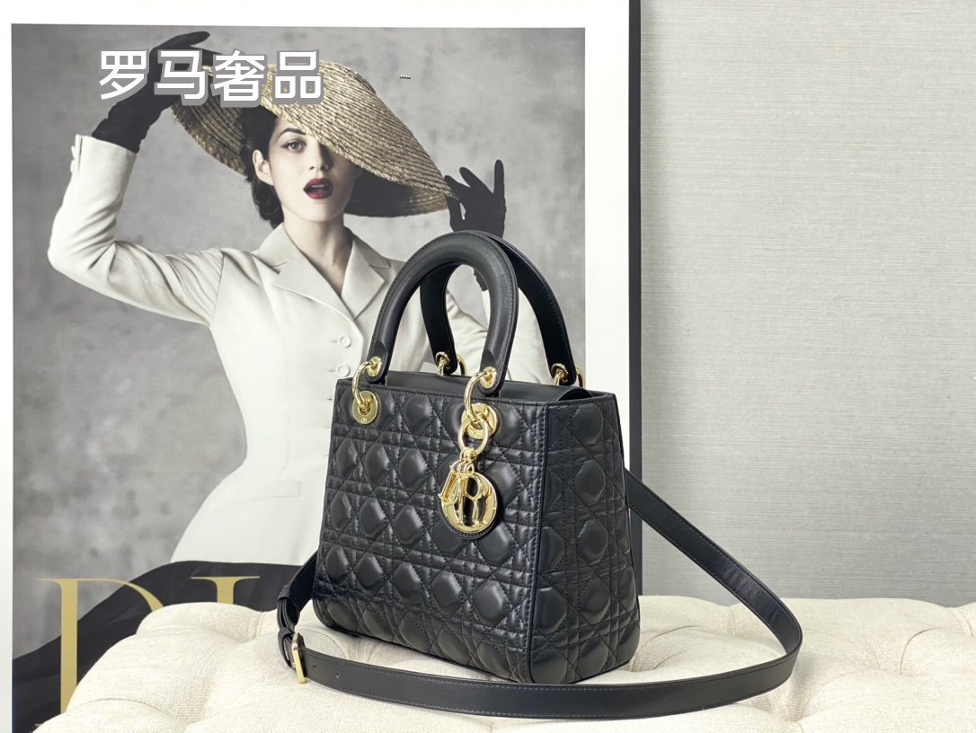Elegant Black Quilted Top Handle Handbag with Gold-Tone Charms