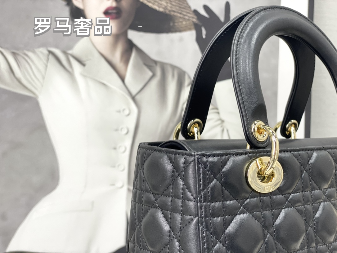 Elegant Black Quilted Top Handle Handbag with Gold-Tone Charms