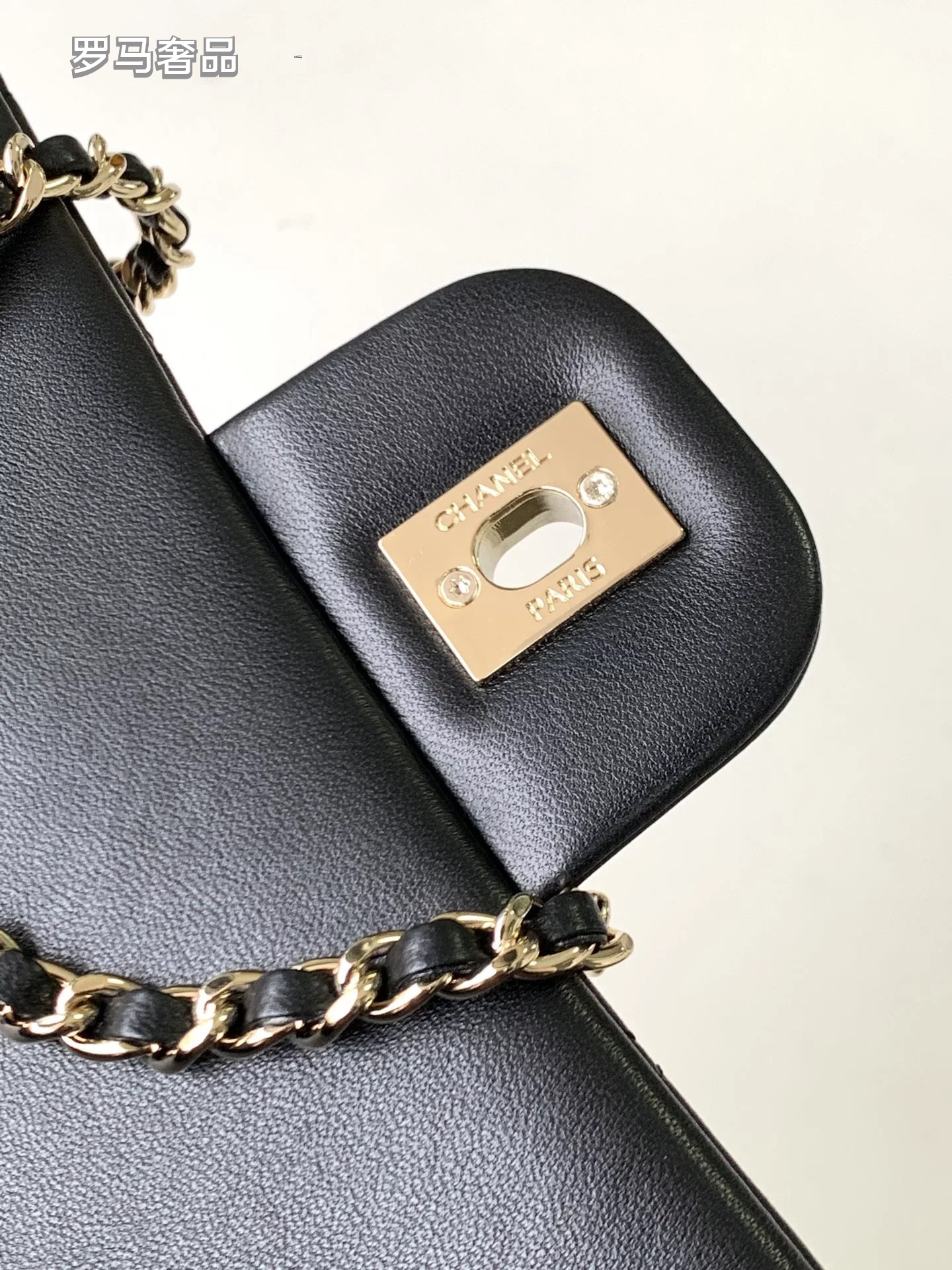 Black Quilted Leather Flap Bag with Crystal Interlocking Logo and Chain Strap